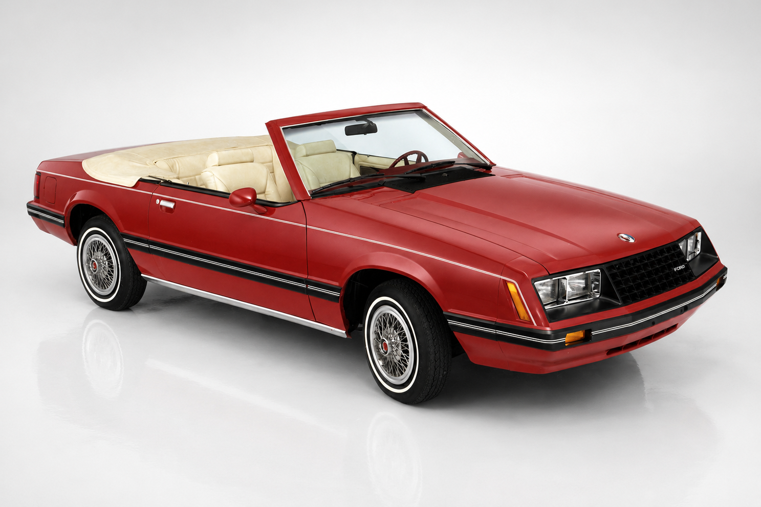 Third-generation Ford Mustang Fox Body in a studio setting, front three-quarter view, showing the aero-nose 1987–93 GT face, side skirts and turbine-style alloy wheels.
