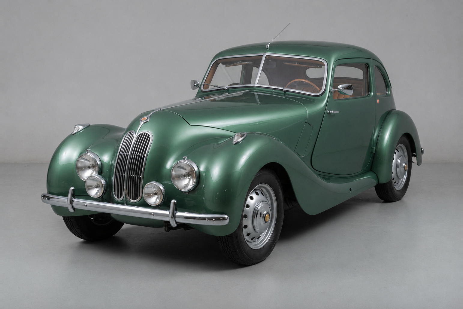 Blue Bristol 400 two-door sports saloon, front three-quarter studio view, showing the tall BMW-style kidney grille, outboard headlamps, flowing alloy body and right-hand-drive cockpit.