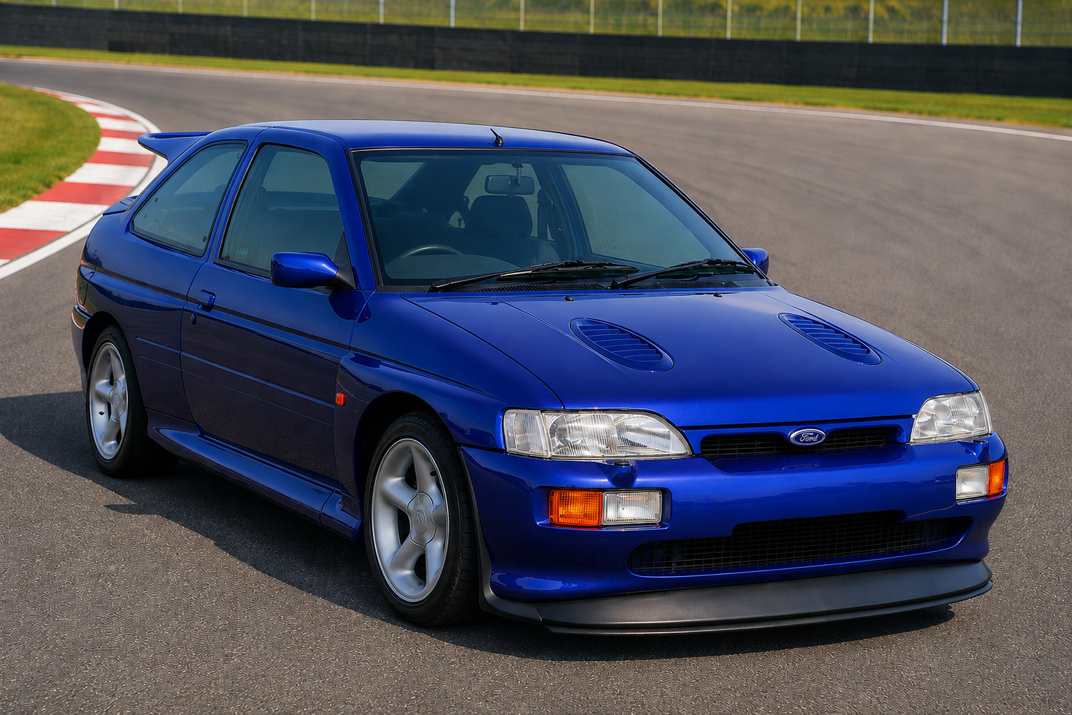 Blue Ford Escort RS Cosworth three-door hatchback on a racetrack, front three-quarter view showing the twin bonnet vents, deep front bumper, five-spoke alloy wheels and four-wheel-drive rally-homologation bodywork.