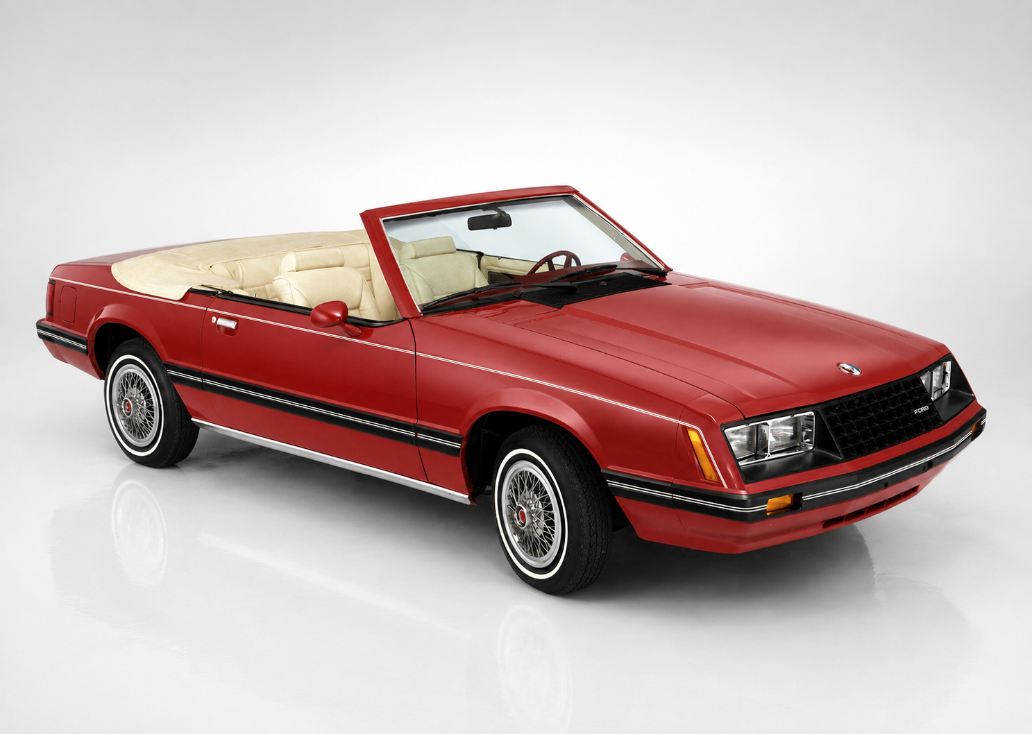 Third-generation Ford Mustang Fox Body in a studio setting, front three-quarter view, showing the aero-nose 1987–93 GT face, side skirts and turbine-style alloy wheels.