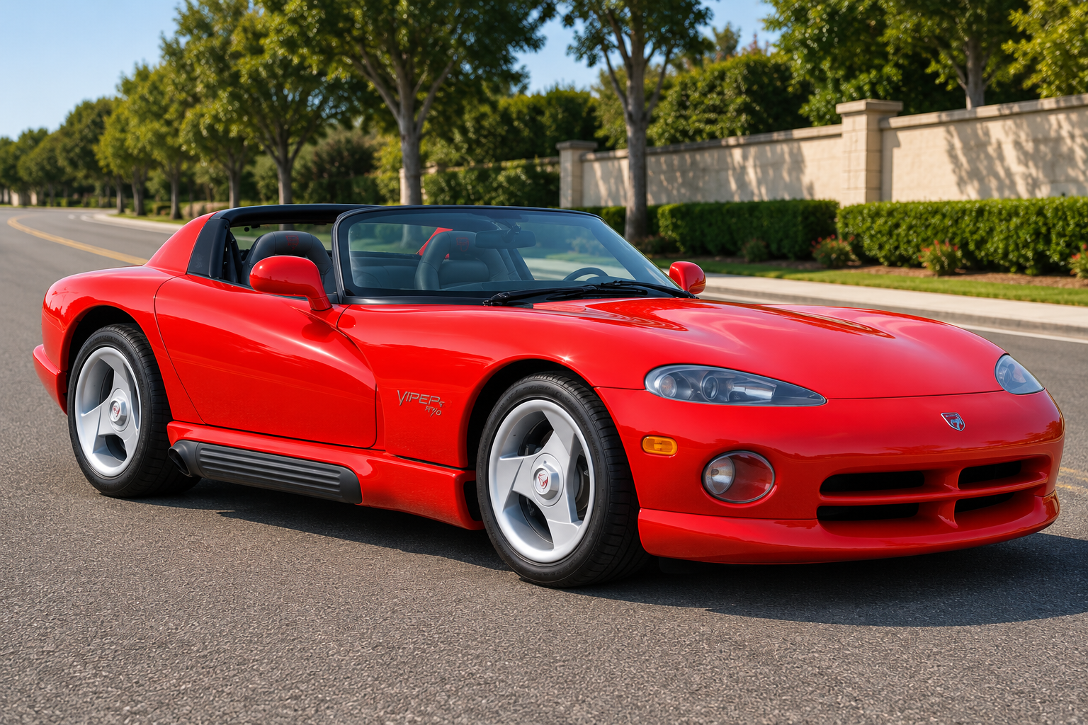 Red first-generation Dodge Viper RT/10 roadster with a removable canvas top, parked on a suburban street.