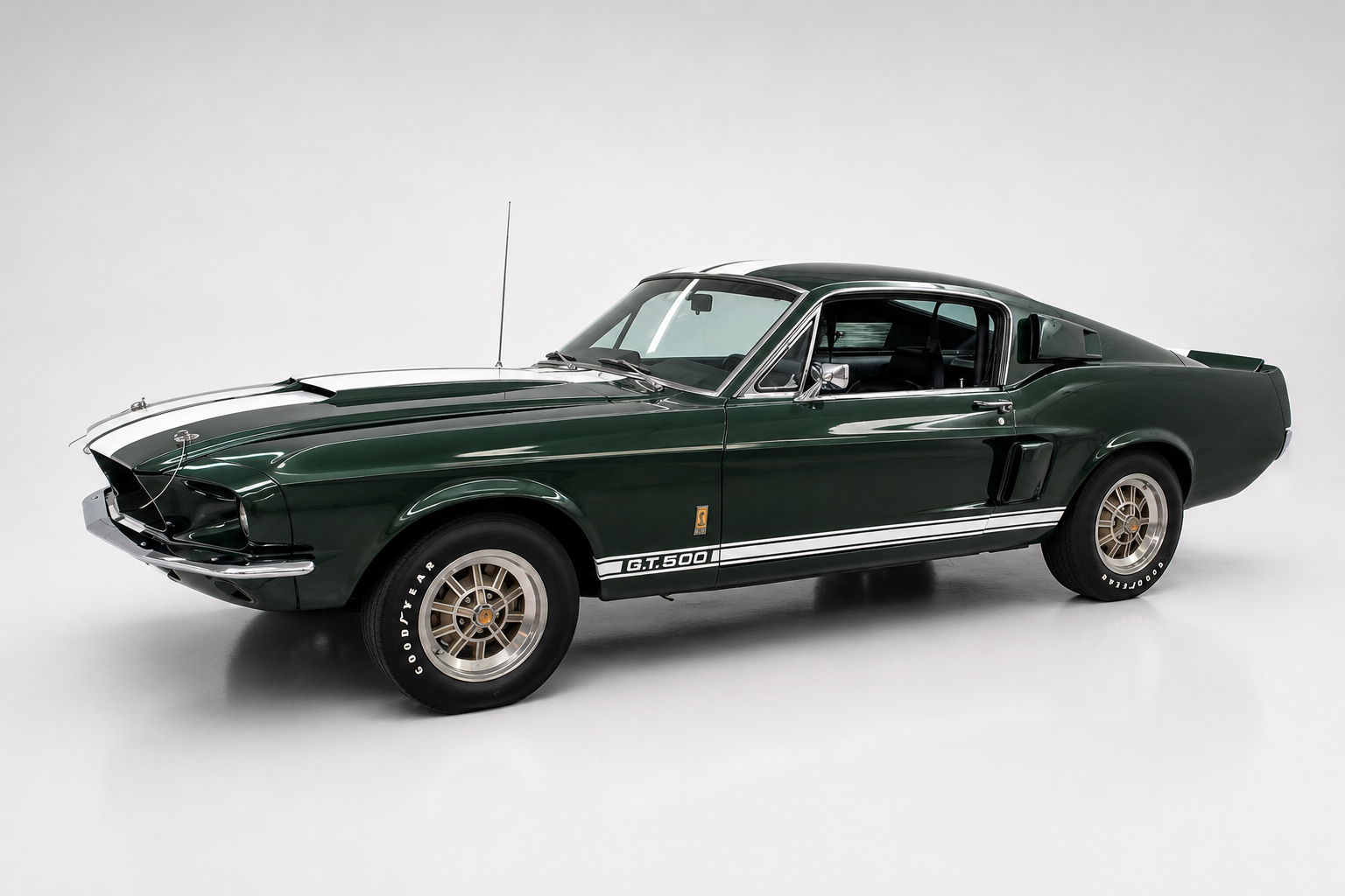 1967 Shelby GT500 fastback in dark green with white stripes, front three-quarter view