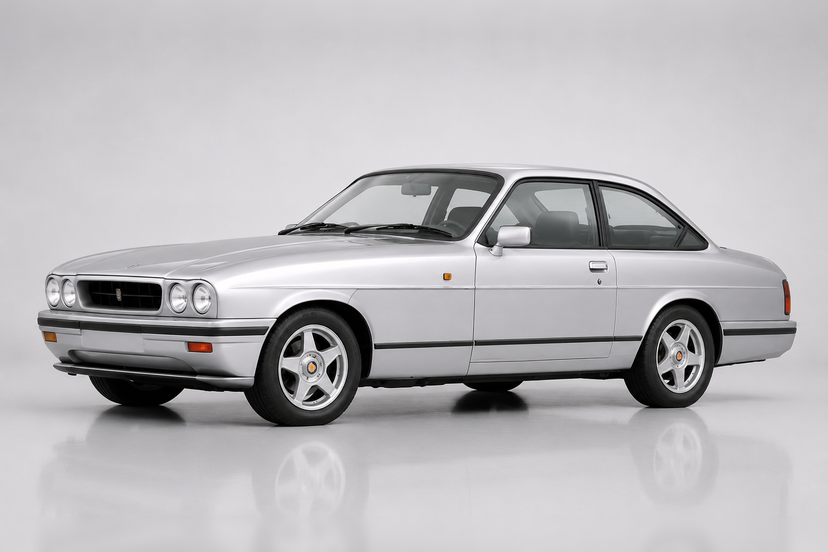 Silver Bristol Blenheim two-door saloon, front three-quarter studio view, showing four round headlamps, an upright grille, chrome trim and a hand-built saloon body.