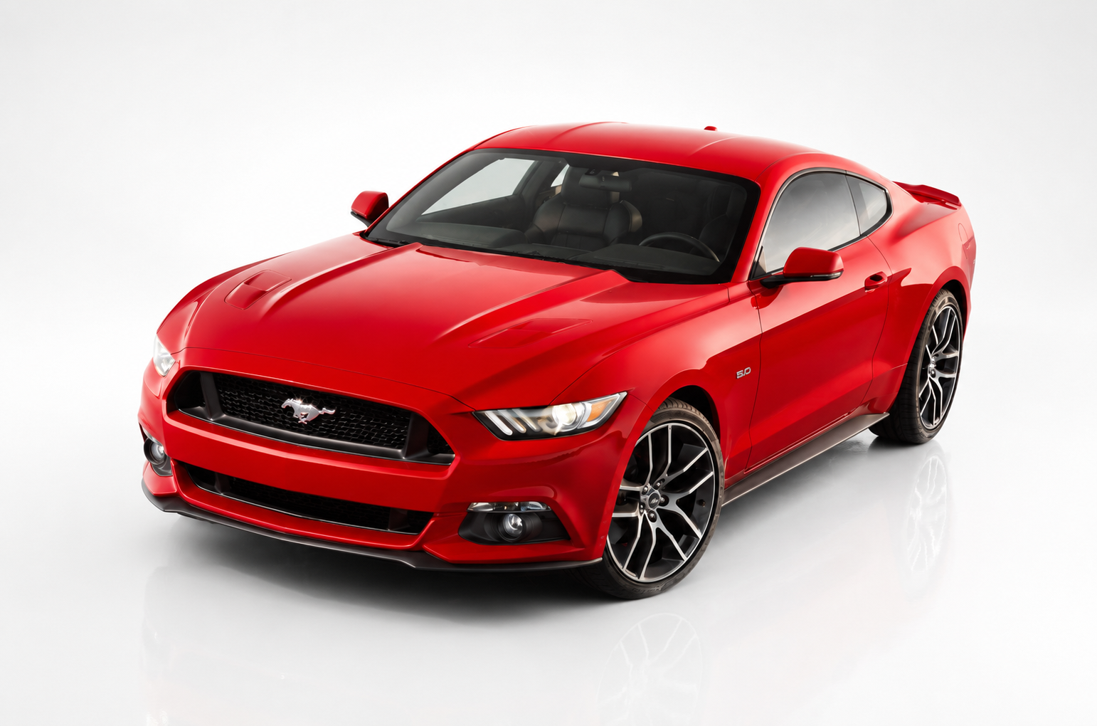Sixth-generation Ford Mustang S550 in a studio setting, front three-quarter view, showing the sharper aero styling, LED tri-bar headlights and multi-spoke alloy wheels.