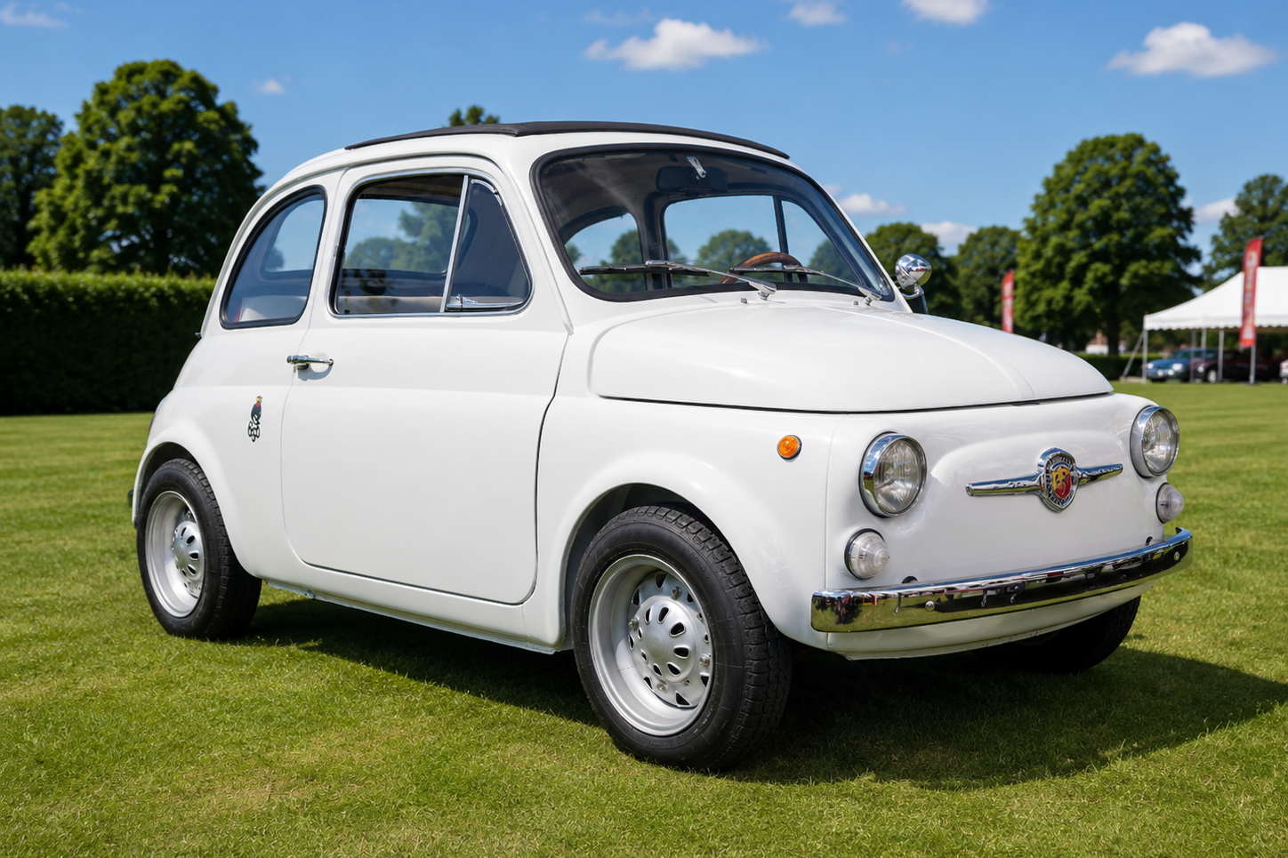 White Fiat Abarth 695 SS at a concours, front three-quarter view