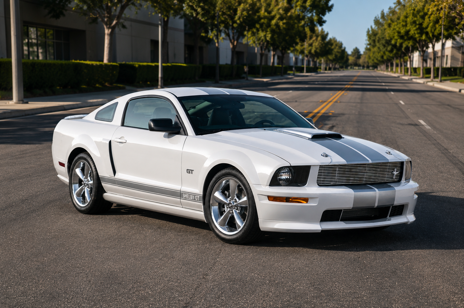 Fifth-generation Ford Mustang S197 in a studio setting, front three-quarter view, showing the retro-modern fastback styling with round headlights, tri-bar tail-lamps and five-spoke alloy wheels.