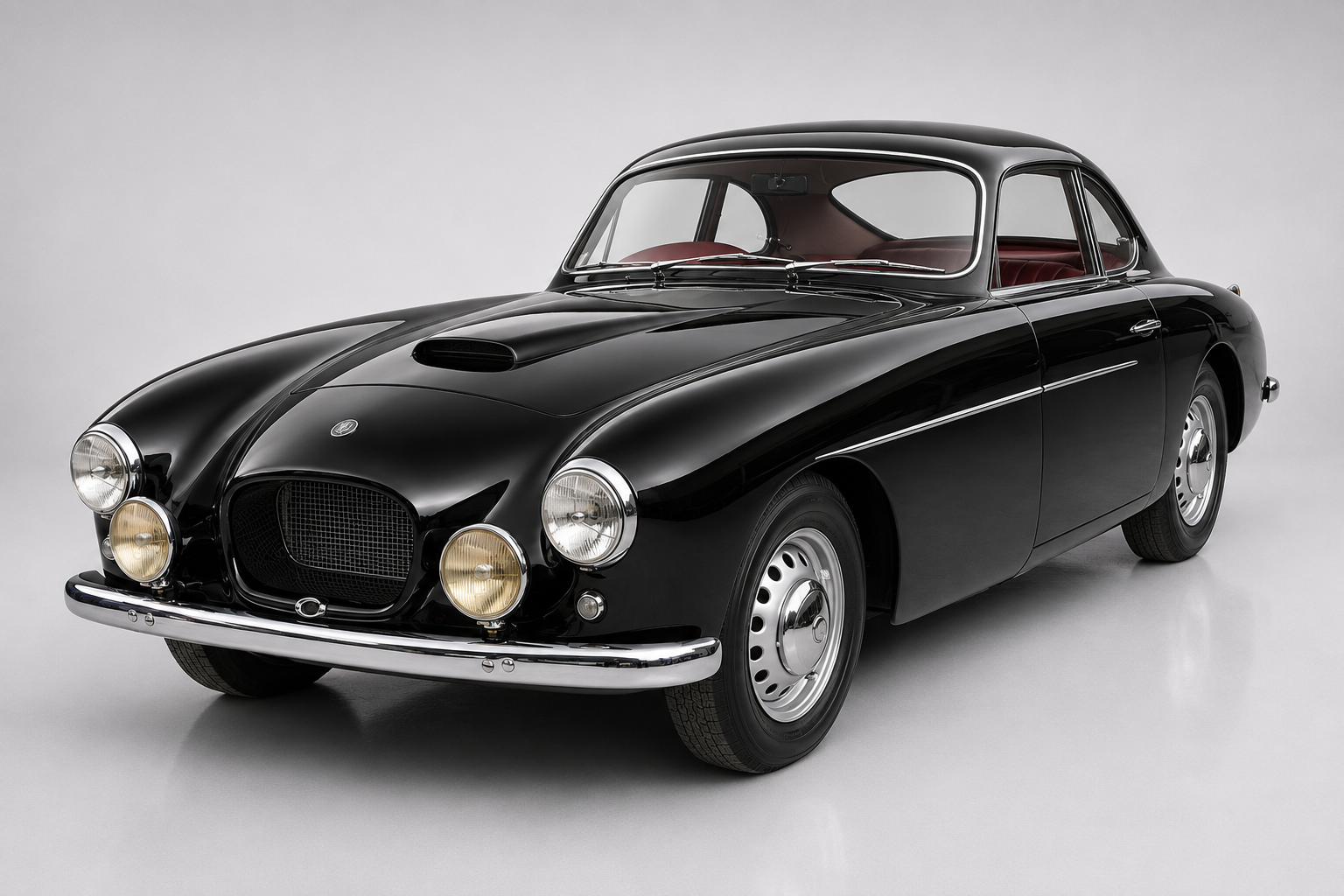 Black Bristol 404 two-door coupé, front three-quarter studio view, showing the oval grille flanked by driving lamps, a bonnet scoop, faired headlamps and Superleggera alloy body.