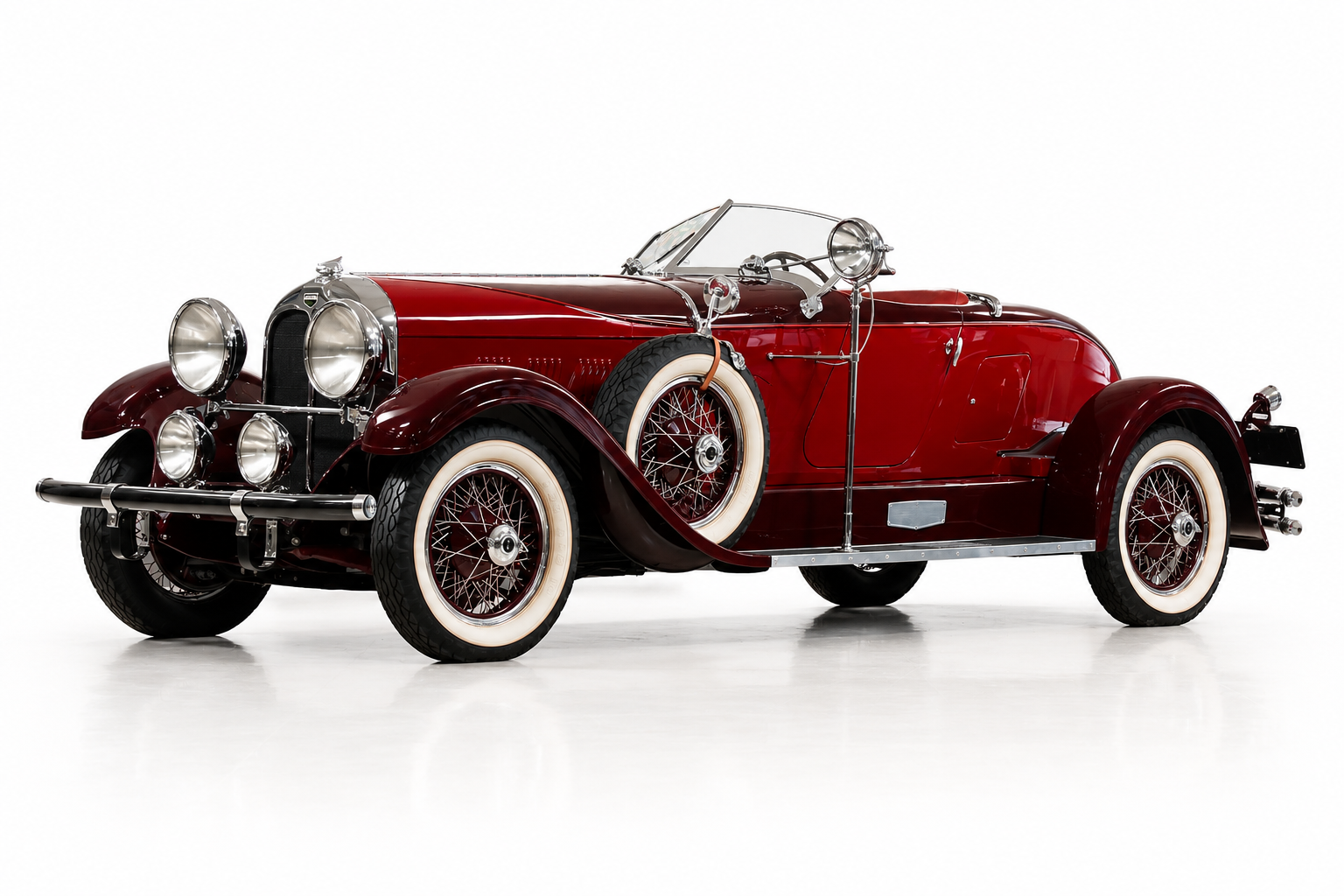 1929 Auburn 8-120 Boattail Speedster in two-tone maroon, front three-quarter view
