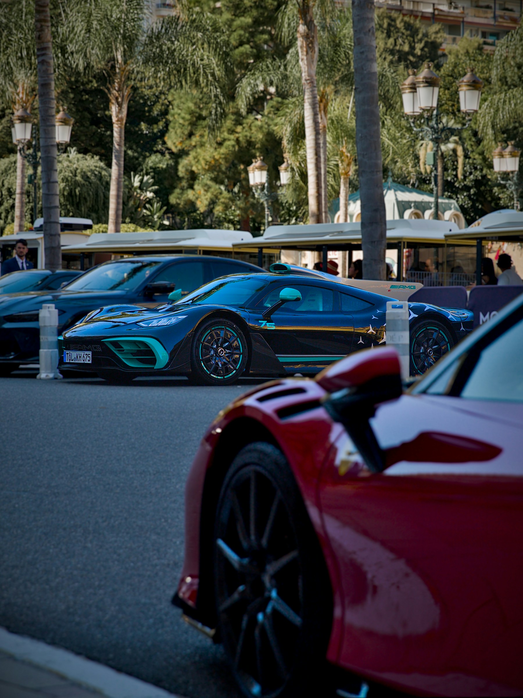 A classic coupé parked on the Monaco quayside at blue-hour dusk.
